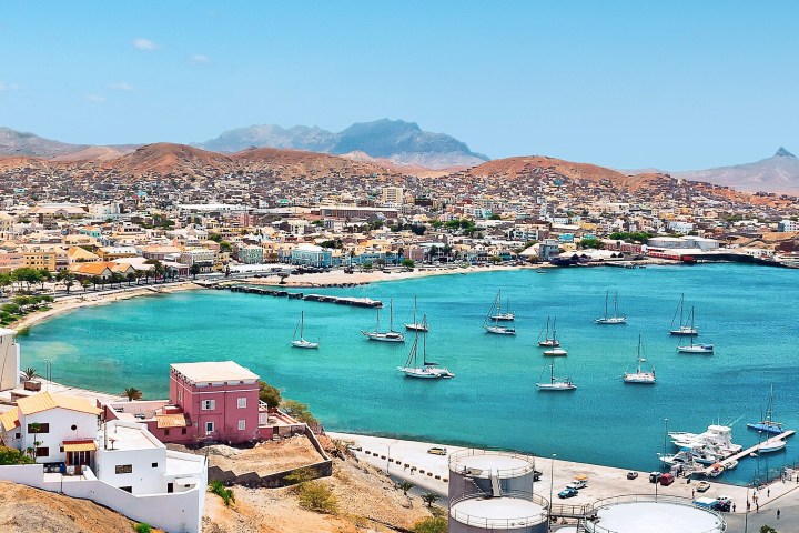 a harbor filled with water and a mountain in the ocean