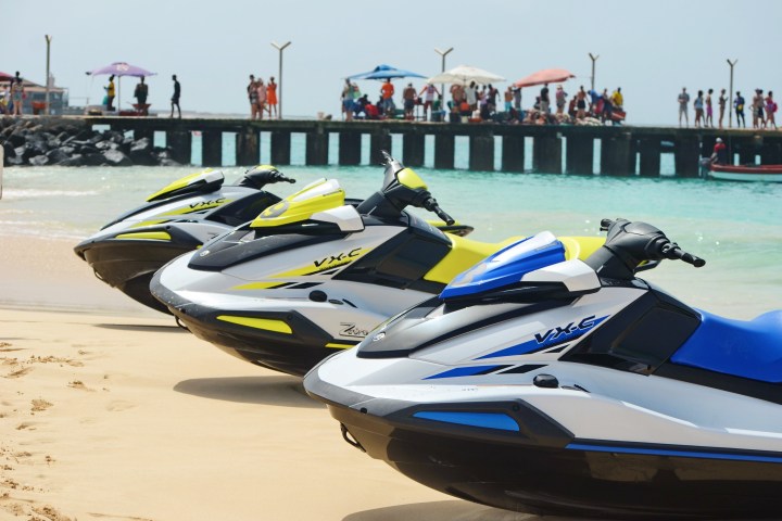 a boat sitting on top of a beach