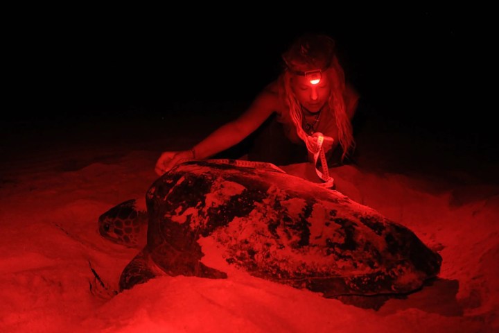 a man sitting in a dark room